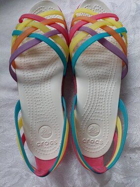 Crocs Isabella Huarache Flat sandals Size 6W in a multicolor rainbow design.